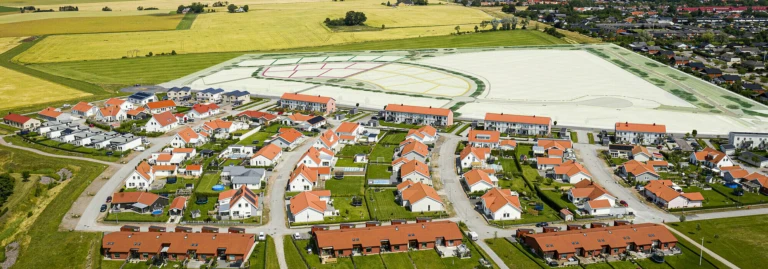 Flygbild över Långåkras utbyggnad